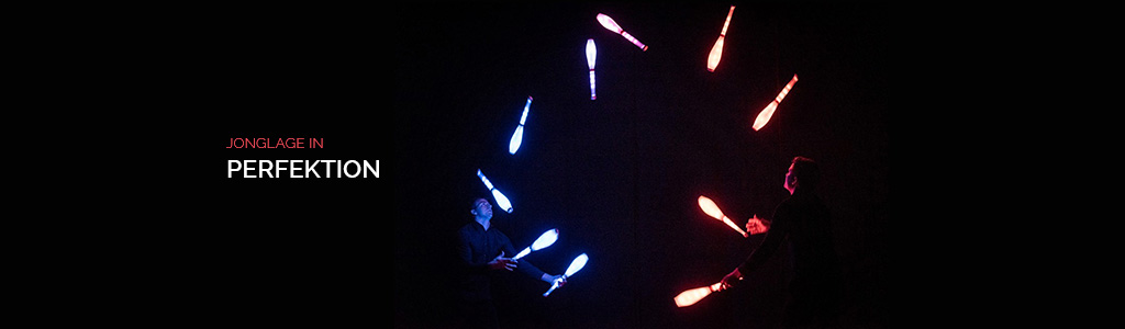 Daniel and Julius Juggling 10 LED clubs on stage